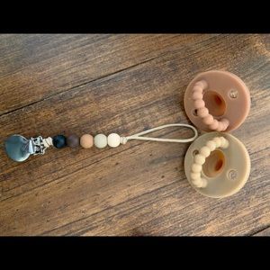 Two flat Ryan and Rose pacifiers w/ matching clip
